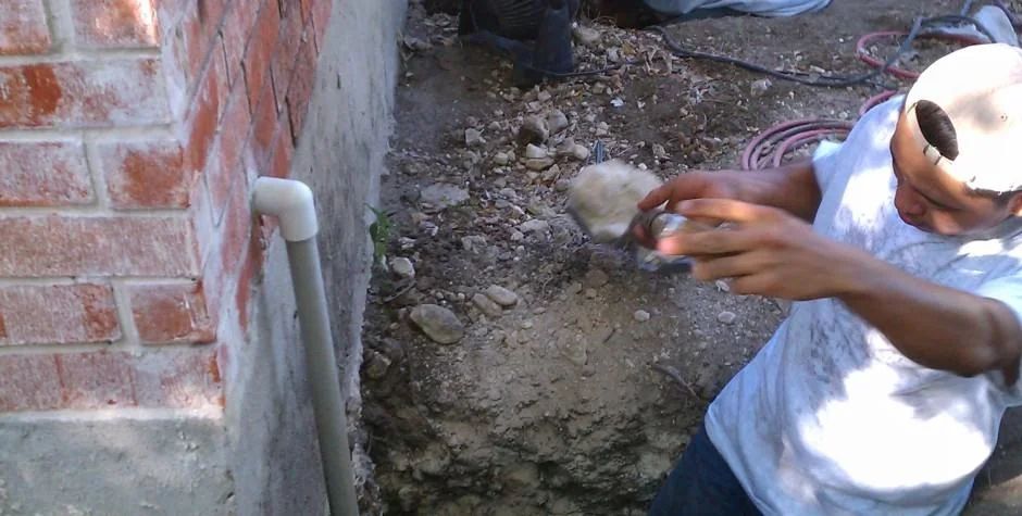 Arredondo Group crew member working at a home's foundation
